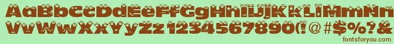 TheLookNormalDb Font – Brown Fonts on Green Background