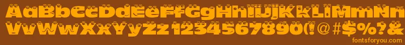 TheLookNormalDb-Schriftart – Orangefarbene Schriften auf braunem Hintergrund