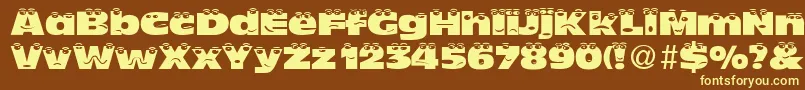 TheLookNormalDb Font – Yellow Fonts on Brown Background