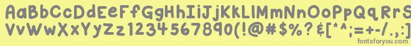 フォントKbcloudyday – 黄色の背景に灰色の文字