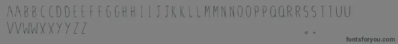 StilettoSkinny.Vfb Font – Black Fonts on Gray Background