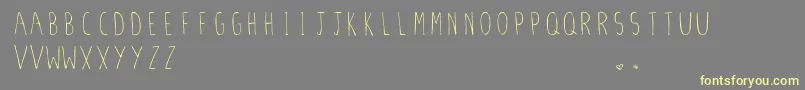 StilettoSkinny.Vfb Font – Yellow Fonts on Gray Background