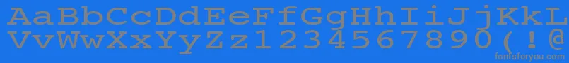 NtcouriervkNormal140n-fontti – harmaat kirjasimet sinisellä taustalla