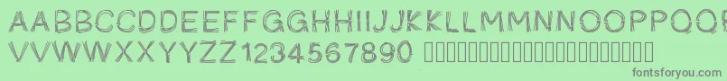Pwficelles-fontti – harmaat kirjasimet vihreällä taustalla
