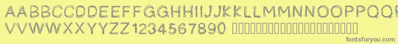 Pwficelles-fontti – harmaat kirjasimet keltaisella taustalla