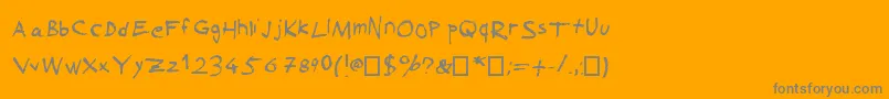 SuckedDry-Schriftart – Graue Schriften auf orangefarbenem Hintergrund