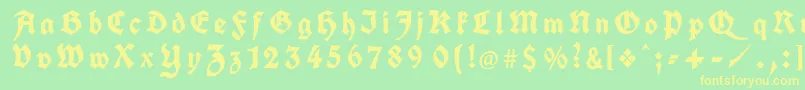 フォントKochFrakturGesperrtUnz1a – 黄色の文字が緑の背景にあります