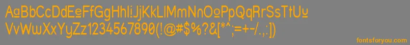 フォントStruprn – オレンジの文字は灰色の背景にあります。
