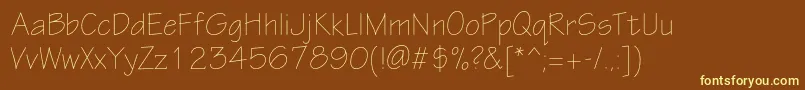Шрифт Eskiztwolightc – жёлтые шрифты на коричневом фоне