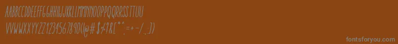Police AracneUltraCondensedRegularItalic – polices grises sur fond brun