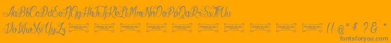 LaCitРІDesMilleReines-Schriftart – Graue Schriften auf orangefarbenem Hintergrund