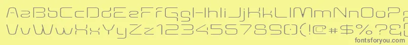 Aunchanted Thin Expanded-Schriftart – Graue Schriften auf gelbem Hintergrund