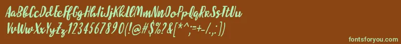 フォントMolleatItalic – 緑色の文字が茶色の背景にあります。