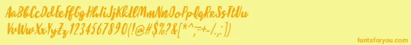 フォントMolleatItalic – オレンジの文字が黄色の背景にあります。