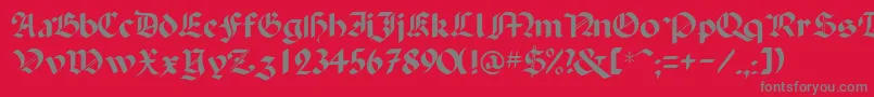 フォントBallistadisplayscriptsskRegular – 赤い背景に灰色の文字