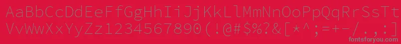 Czcionka SourcecodeproExtralight – szare czcionki na czerwonym tle