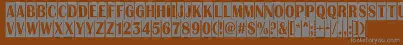AAlbionictitulnrcm-fontti – harmaat kirjasimet ruskealla taustalla