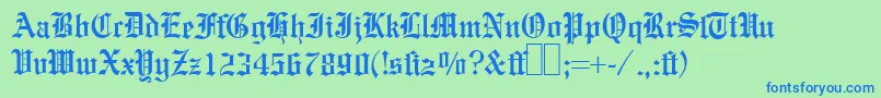 E780BlackletterRegular-fontti – siniset fontit vihreällä taustalla