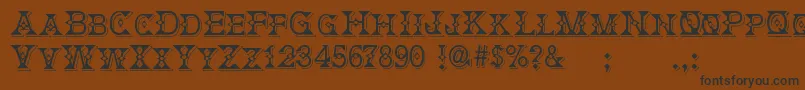 DeborahFancyDress Font – Black Fonts on Brown Background