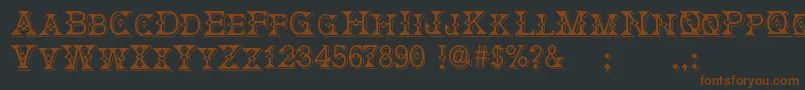 Fonte DeborahFancyDress – fontes marrons em um fundo preto