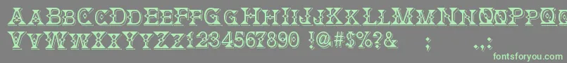 DeborahFancyDress Font – Green Fonts on Gray Background