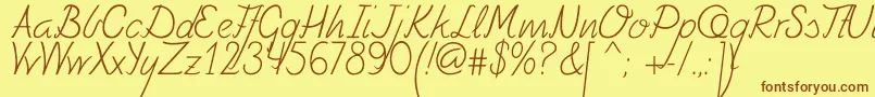 フォントFely – 茶色の文字が黄色の背景にあります。