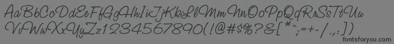 フォントStudioscriptatt – 黒い文字の灰色の背景