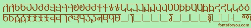 Qijomi-fontti – ruskeat fontit vihreällä taustalla