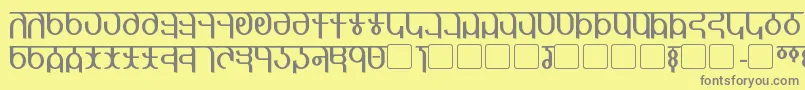 Qijomi-fontti – harmaat kirjasimet keltaisella taustalla
