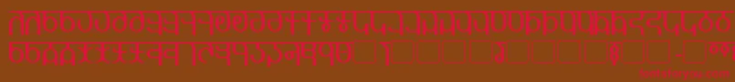 フォントQijomi – 赤い文字が茶色の背景にあります。