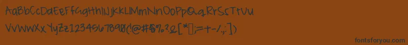 フォントPeameaghan – 黒い文字が茶色の背景にあります