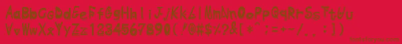 Heart Emboss-Schriftart – Braune Schriften auf rotem Hintergrund