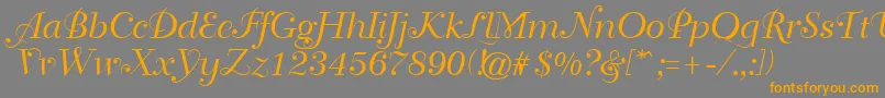 フォントGeTravelscript – オレンジの文字は灰色の背景にあります。