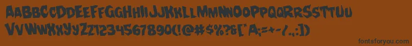 Nightchilderotate-Schriftart – Schwarze Schriften auf braunem Hintergrund