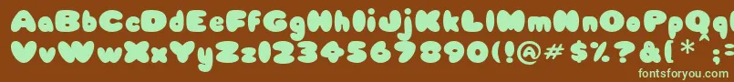 Babycakes-fontti – vihreät fontit ruskealla taustalla