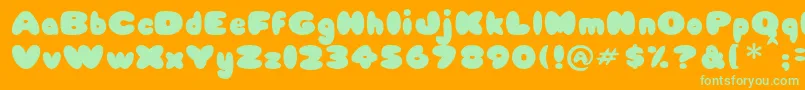 Babycakes Font – Green Fonts on Orange Background