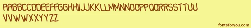 XenikFreePromo Font – Brown Fonts on Yellow Background
