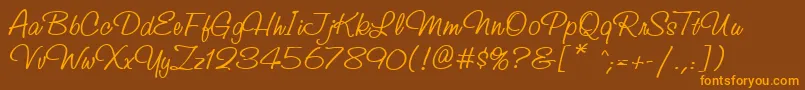 StudioscriptcttRegular Font – Orange Fonts on Brown Background