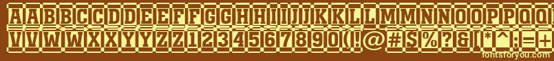 AMonumentottldccm-fontti – keltaiset fontit ruskealla taustalla