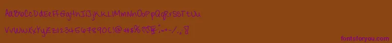 Candydelish-Schriftart – Violette Schriften auf braunem Hintergrund