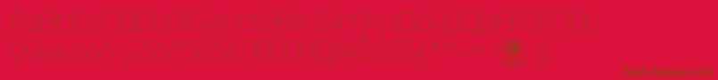QuizmaThinDemo-fontti – ruskeat fontit punaisella taustalla
