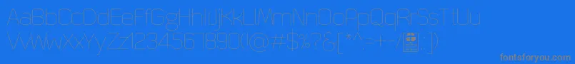 QuizmaThinDemo-fontti – harmaat kirjasimet sinisellä taustalla
