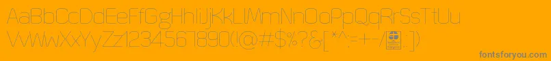 Czcionka QuizmaThinDemo – szare czcionki na pomarańczowym tle