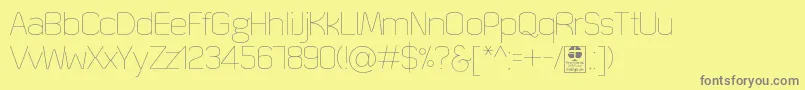Шрифт QuizmaThinDemo – серые шрифты на жёлтом фоне