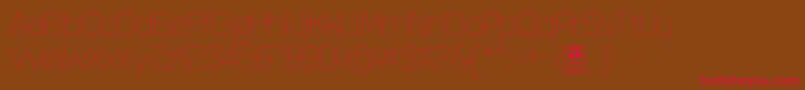 QuizmaThinDemo Font – Red Fonts on Brown Background