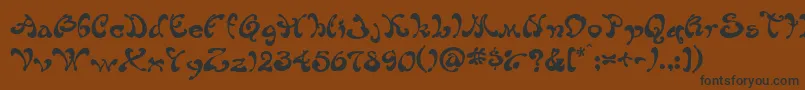 フォントHabibe – 黒い文字が茶色の背景にあります