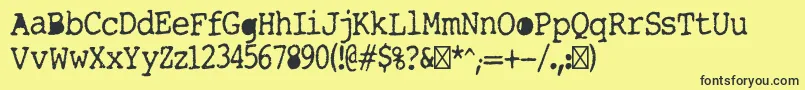 Tightwriter-Schriftart – Schwarze Schriften auf gelbem Hintergrund