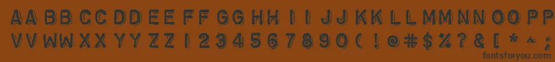 フォントChromosomeheavy – 黒い文字が茶色の背景にあります