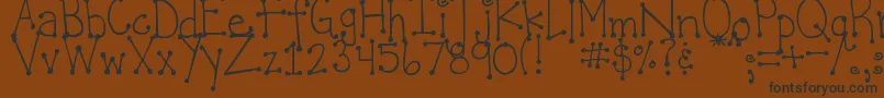 Czcionka DjbItsFullOfDots – czarne czcionki na brązowym tle