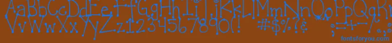 Fonte DjbItsFullOfDots – fontes azuis em um fundo marrom